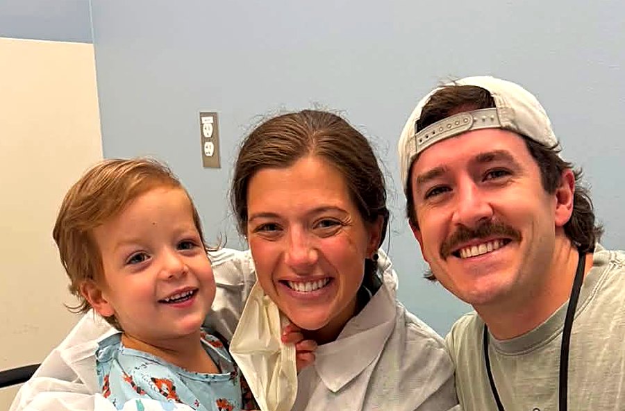 Carter with his mum and dad on treatment day