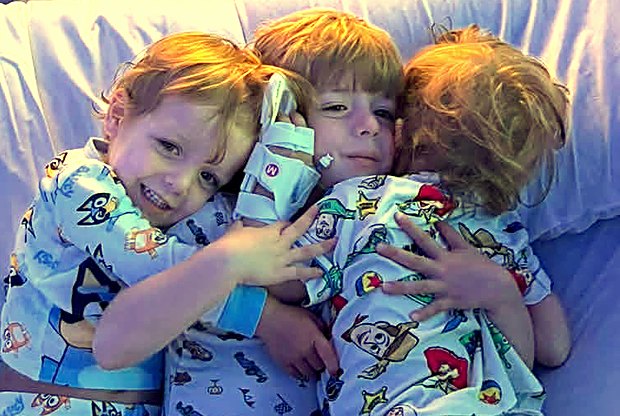 Carter and his brothers piled up together
