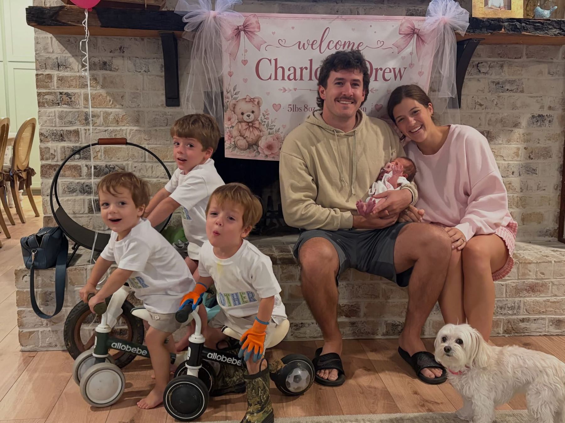 Carter with his mum, dad, brothers, newborn sister Charlotte Drew and the family dog