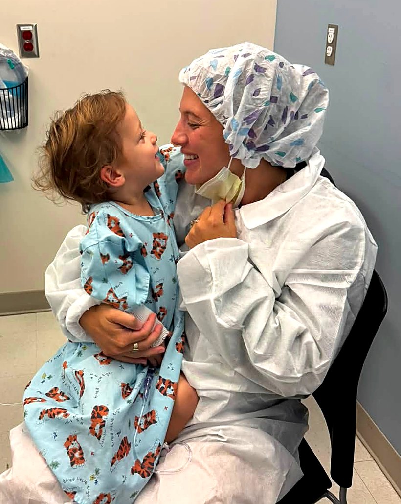 Brooke holding Carter forehead-to-forehead before his surgery