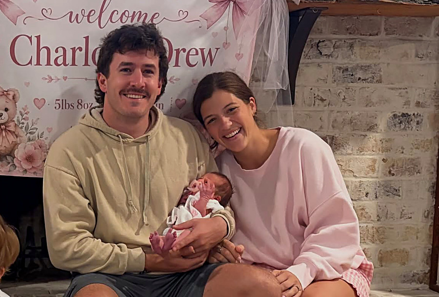 Carter's mum and dad with his newborn sister