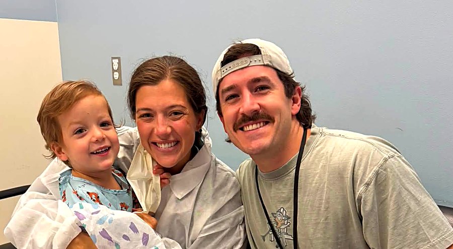 Carter with his mum and dad
