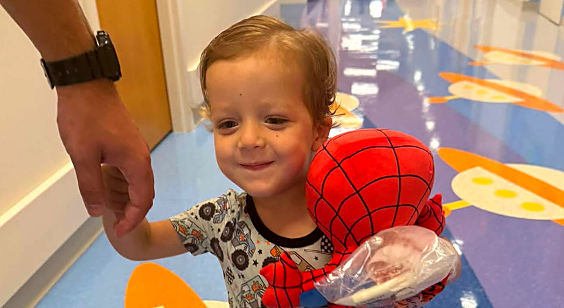 Carter walking the hallway with his Spider-Man